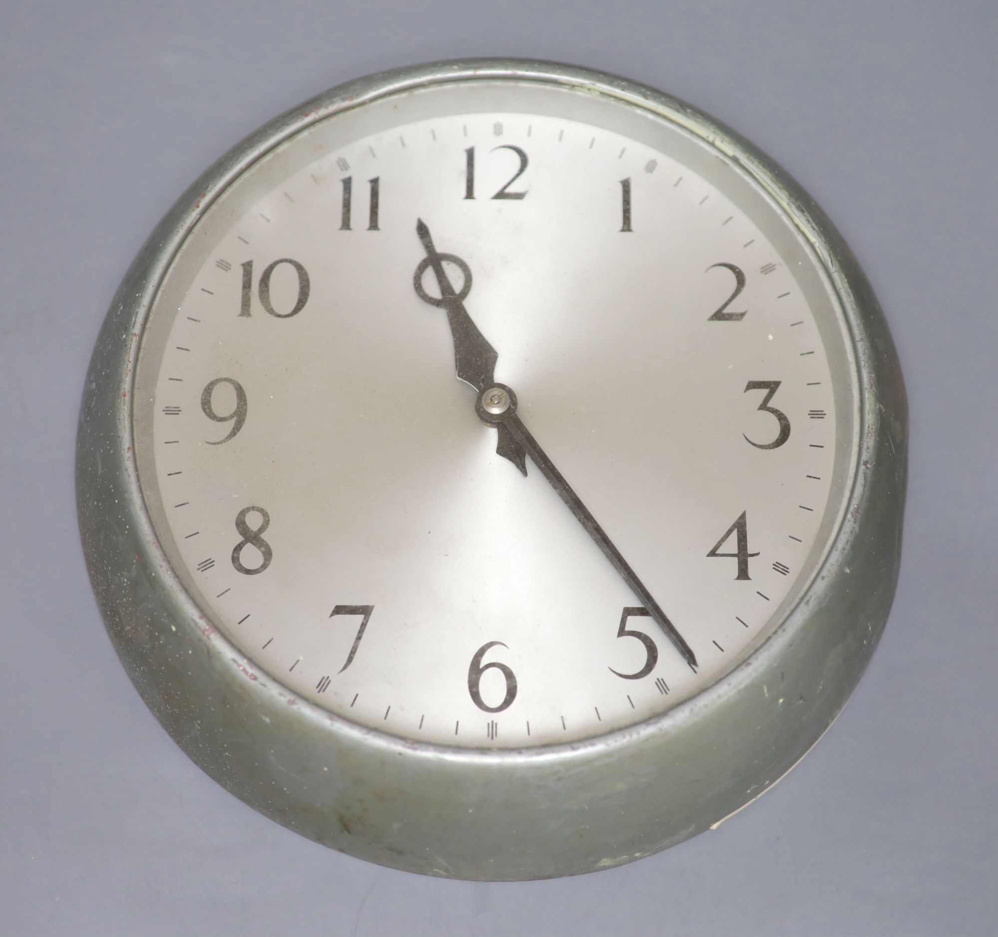 A metal cased circular slave clock, the reverse inscribed GPO